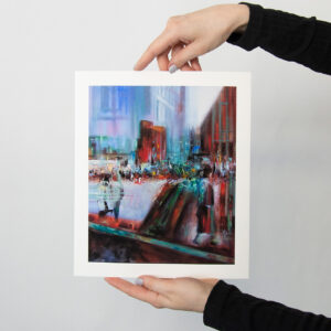 The print "Schichtwechsel" by Evelina Klanikova shows an abstracted urban landscape with layered textures in shades of blue, red and green.